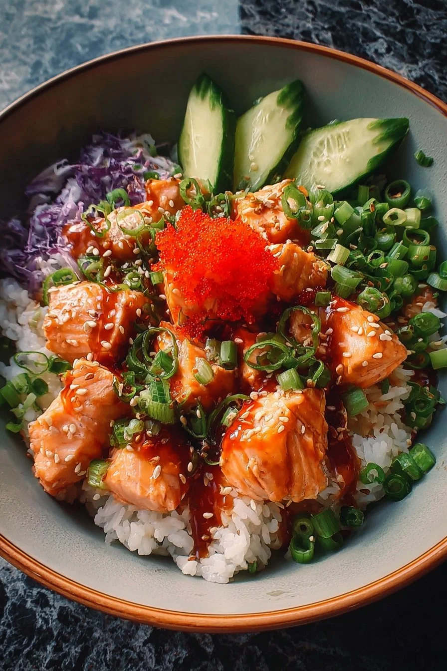 A vibrant Spicy Salmon Bowl garnished with fresh vegetables and sesame seeds