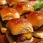 Delicious cheeseburger sliders stacked on a plate with toppings