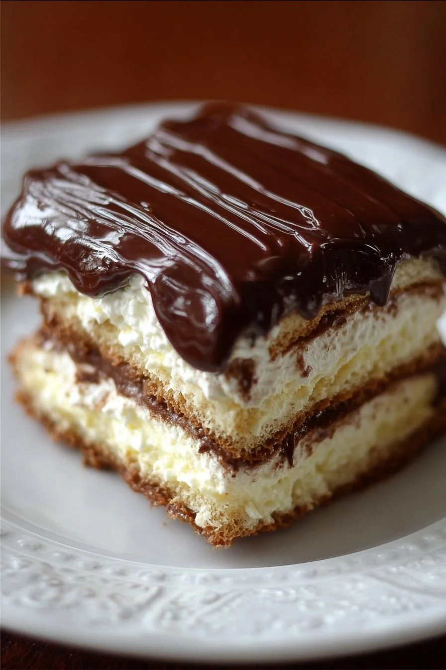 Delicious Eclair Icebox Cake with chocolate glaze and creamy filling