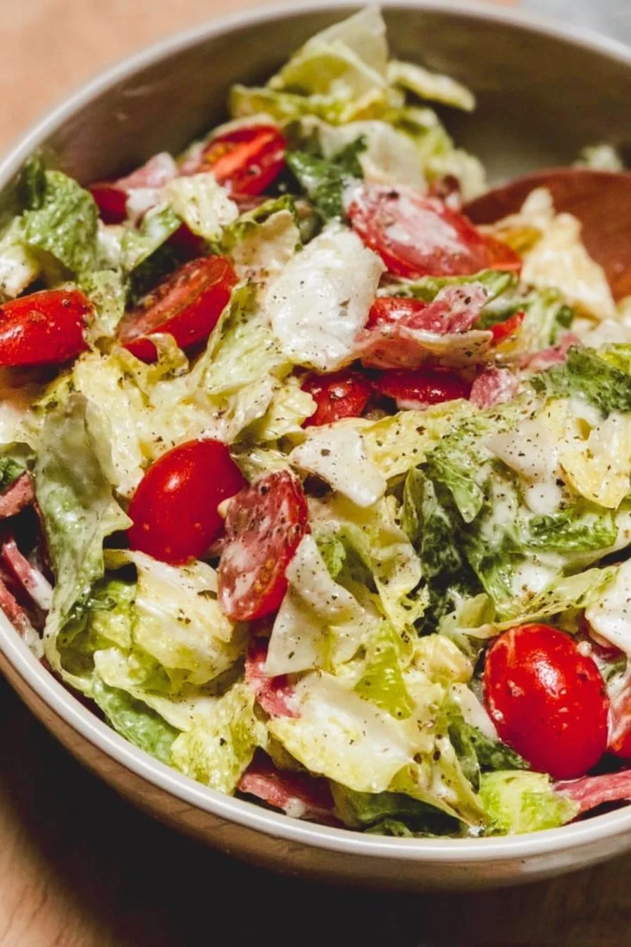 Colorful bowl of homemade Grinder Salad with fresh vegetables and dressing