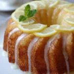 Delicious homemade Lemon Bundt Cake decorated with icing and lemon zest