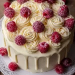 Delicious Raspberry Cake layered with creamy Lemon Buttercream frosting.